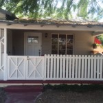 white picket fence and gate with barn doors image