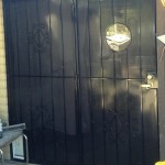 black screen door with spiral design image