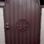 arched side gate door with spiral design image