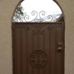 brown side gate door arched with spirals design image