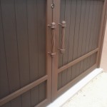 wood and steel double doors with handles image