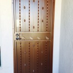 brown screen door with quail design image