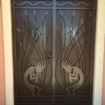 brown custom security screen door with kokopelli design image