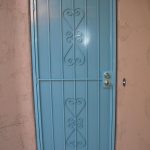 blue custom security door with scroll design from the larger company tucson image